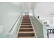 Staircase with light walls and carpeted steps leading to the upper level at 1379 E Price Blvd, North Port, FL 34288