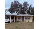 Ranch-style home with carport and small yard at 1519 30Th St, Sarasota, FL 34234