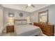 Bedroom with wood furniture, ceiling fan, and decorative mirror at 205 Oak Hill Dr # 7, Sarasota, FL 34232