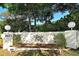 Village Oaks community entrance with landscaping and signage at 205 Oak Hill Dr # 7, Sarasota, FL 34232