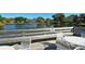 Community dock with seating and a picturesque lake view at 205 Oak Hill Dr # 7, Sarasota, FL 34232