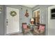 Inviting entryway with seating area and charming decor at 205 Oak Hill Dr # 7, Sarasota, FL 34232