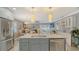 Modern kitchen with island and stainless steel appliances at 205 Oak Hill Dr # 7, Sarasota, FL 34232