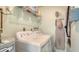 Convenient laundry room with washer, dryer, and shelving at 205 Oak Hill Dr # 7, Sarasota, FL 34232