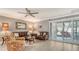 Bright living room features neutral walls and wood-look floors at 205 Oak Hill Dr # 7, Sarasota, FL 34232