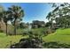 Peaceful pond view with fountain and lush greenery at 205 Oak Hill Dr # 7, Sarasota, FL 34232