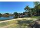 Community shuffleboard courts near pond and buildings at 205 Oak Hill Dr # 7, Sarasota, FL 34232