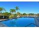 Community swimming pool with lounge chairs and a deck at 205 Oak Hill Dr # 7, Sarasota, FL 34232