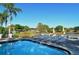 Refreshing community pool with plenty of lounge chairs at 205 Oak Hill Dr # 7, Sarasota, FL 34232