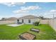 Backyard with patio and raised garden beds at 208 Cascade Bend Dr, Ruskin, FL 33570