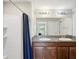 Bathroom with double vanity, shower, and mirror at 208 Cascade Bend Dr, Ruskin, FL 33570