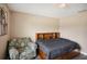 Bedroom with wood flooring, chair and a bed at 208 Cascade Bend Dr, Ruskin, FL 33570