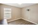 Bright bedroom with wood flooring and window coverings at 208 Cascade Bend Dr, Ruskin, FL 33570