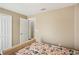 Spacious bedroom with patterned bedding and an ensuite bathroom at 208 Cascade Bend Dr, Ruskin, FL 33570