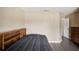Cozy bedroom with built-in shelving and gray bedding at 208 Cascade Bend Dr, Ruskin, FL 33570