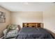 Bedroom with wood flooring, chair and a bed at 208 Cascade Bend Dr, Ruskin, FL 33570