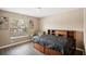 Bedroom with wood flooring, chair and a bed at 208 Cascade Bend Dr, Ruskin, FL 33570