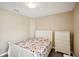 Well-lit bedroom featuring a white bed frame and dresser at 208 Cascade Bend Dr, Ruskin, FL 33570