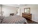 Bedroom with wood furniture and gray and white bedding at 208 Cascade Bend Dr, Ruskin, FL 33570