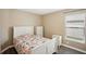 Bright bedroom with white dresser and patterned bedding at 208 Cascade Bend Dr, Ruskin, FL 33570