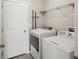Laundry room with washer, dryer, and overhead shelving at 208 Cascade Bend Dr, Ruskin, FL 33570