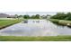 View of a pond in a residential community at 208 Cascade Bend Dr, Ruskin, FL 33570