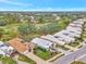 Wide shot of houses near golf course with spacious lots and mature trees at 230 Vestavia Dr, Venice, FL 34292
