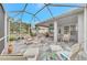 Large covered patio with multiple seating areas at 230 Vestavia Dr, Venice, FL 34292