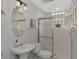 Small bathroom with shower and pedestal sink at 230 Vestavia Dr, Venice, FL 34292