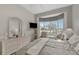 Well-lit bedroom with large window and wicker furniture at 230 Vestavia Dr, Venice, FL 34292