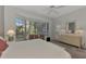 Spacious bedroom with large window and sitting area at 230 Vestavia Dr, Venice, FL 34292