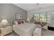 Bright bedroom with a sitting area and large window at 230 Vestavia Dr, Venice, FL 34292