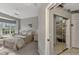 Spacious bedroom with bay window and en-suite bathroom access at 230 Vestavia Dr, Venice, FL 34292