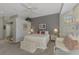 Primary bedroom with sitting area and plenty of natural light at 230 Vestavia Dr, Venice, FL 34292