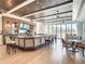 Upscale clubhouse bar with a large TV and comfortable seating at 230 Vestavia Dr, Venice, FL 34292