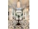 Bright clubhouse lobby featuring a round table and seating area at 230 Vestavia Dr, Venice, FL 34292