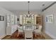 Bright dining area with a hexagonal table and coordinating chairs at 230 Vestavia Dr, Venice, FL 34292