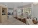 Elegant dining room with a glass-top table and chandelier at 230 Vestavia Dr, Venice, FL 34292