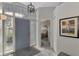 Entryway with tiled floor, gray door and stained glass windows at 230 Vestavia Dr, Venice, FL 34292