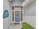 Front entry with decorative door, stained-glass windows, and tile flooring at 230 Vestavia Dr, Venice, FL 34292