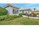 House exterior featuring a bay window and well-manicured landscaping at 230 Vestavia Dr, Venice, FL 34292