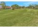 Expansive view of a well-manicured golf course at 230 Vestavia Dr, Venice, FL 34292