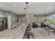 Modern kitchen with expansive granite countertop and island at 230 Vestavia Dr, Venice, FL 34292