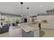 Open kitchen with breakfast bar and view to living room at 230 Vestavia Dr, Venice, FL 34292