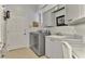 Laundry room with washer, dryer and cabinets at 230 Vestavia Dr, Venice, FL 34292