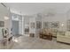 Bright living room with neutral-toned furniture and large windows at 230 Vestavia Dr, Venice, FL 34292