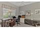 Home office with built-in desk and window at 230 Vestavia Dr, Venice, FL 34292