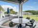 Enjoy the outdoors at this round table with a curved bench at 230 Vestavia Dr, Venice, FL 34292