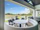 Relaxing outdoor seating area with a view of the golf course at 230 Vestavia Dr, Venice, FL 34292