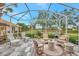 Spacious screened patio overlooking a golf course at 230 Vestavia Dr, Venice, FL 34292